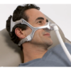 A man using the Philips Respironics Wisp Nasal Mask