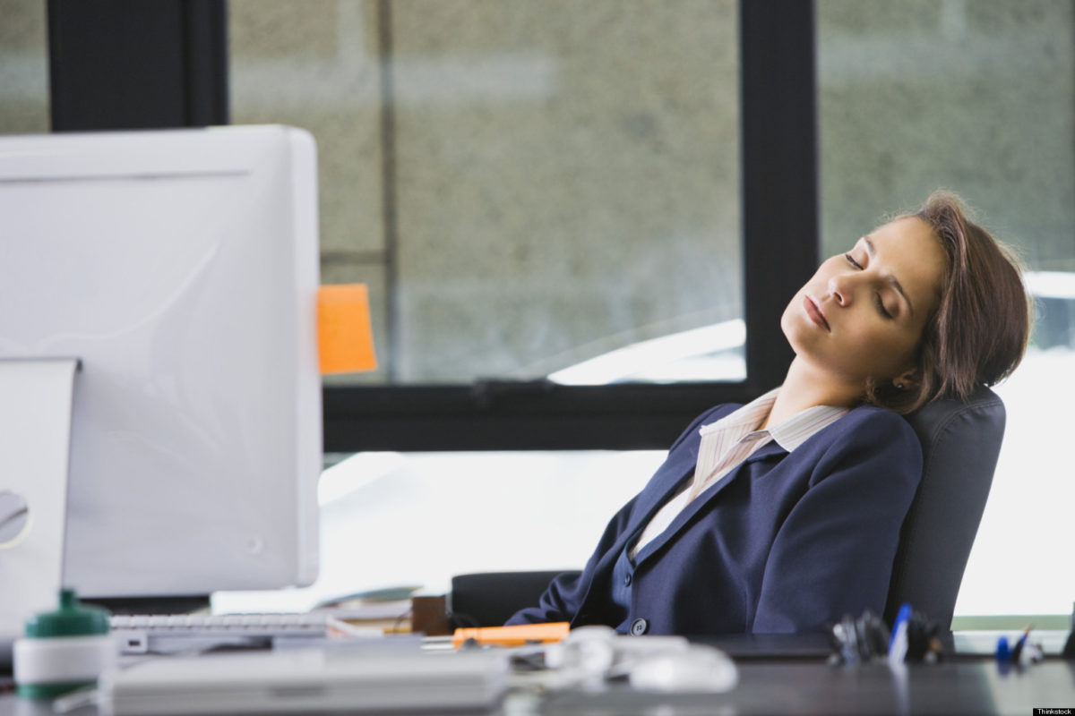 Businesswoman sleeping at desk