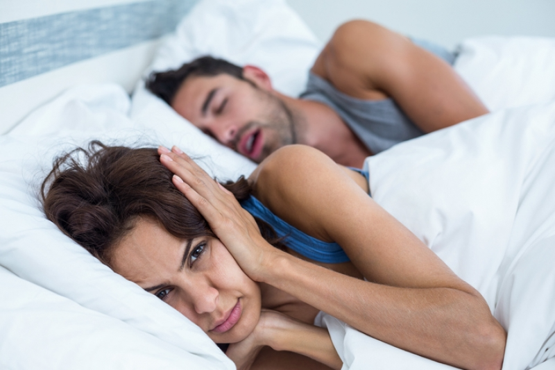 snoring partner disturbing the sleep of the other partner