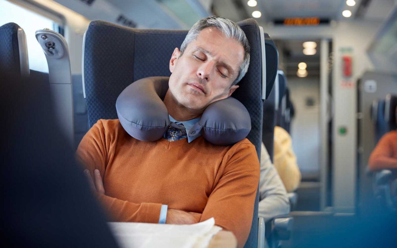 man sleeping on the train