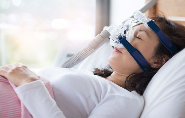ResMed CPAP mask sleeping woman
